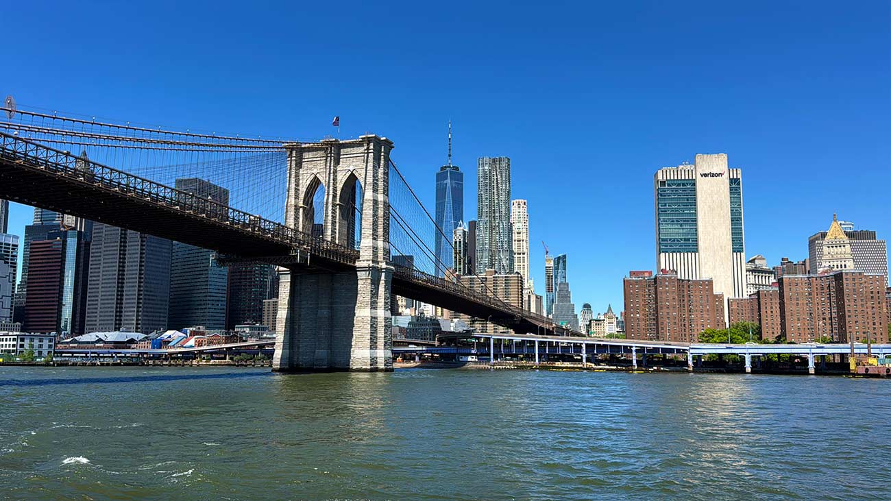 Brooklyn Bridge views from New York Harbor at sunset